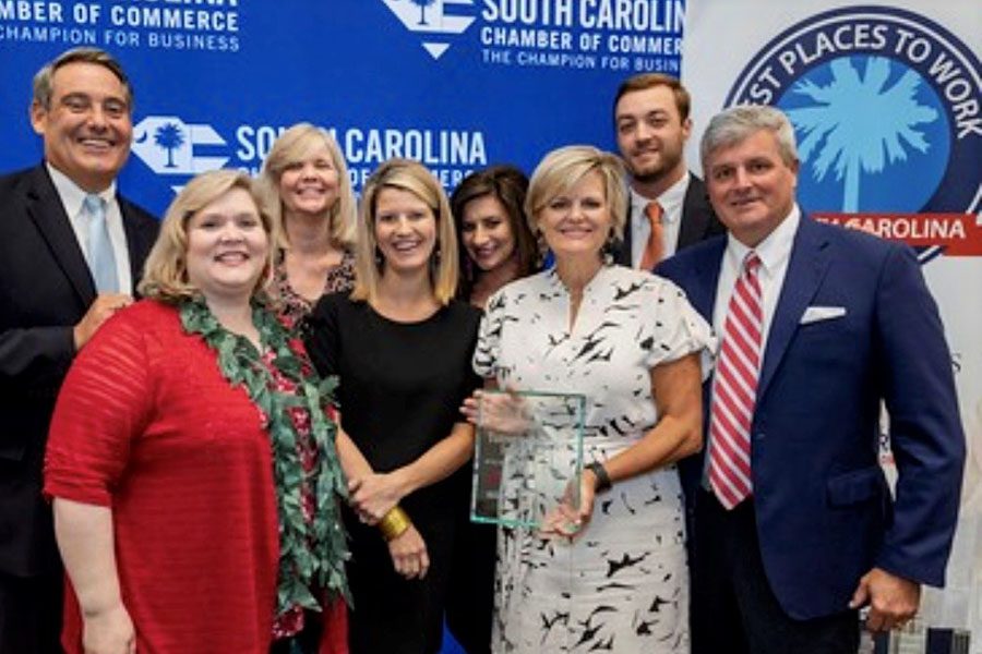 Refer A Friend - Turner Agency Staff Accepting Best Places To Work Award